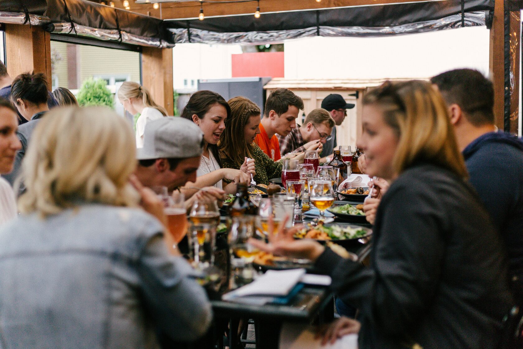 People gathered around a dinner table at a community event